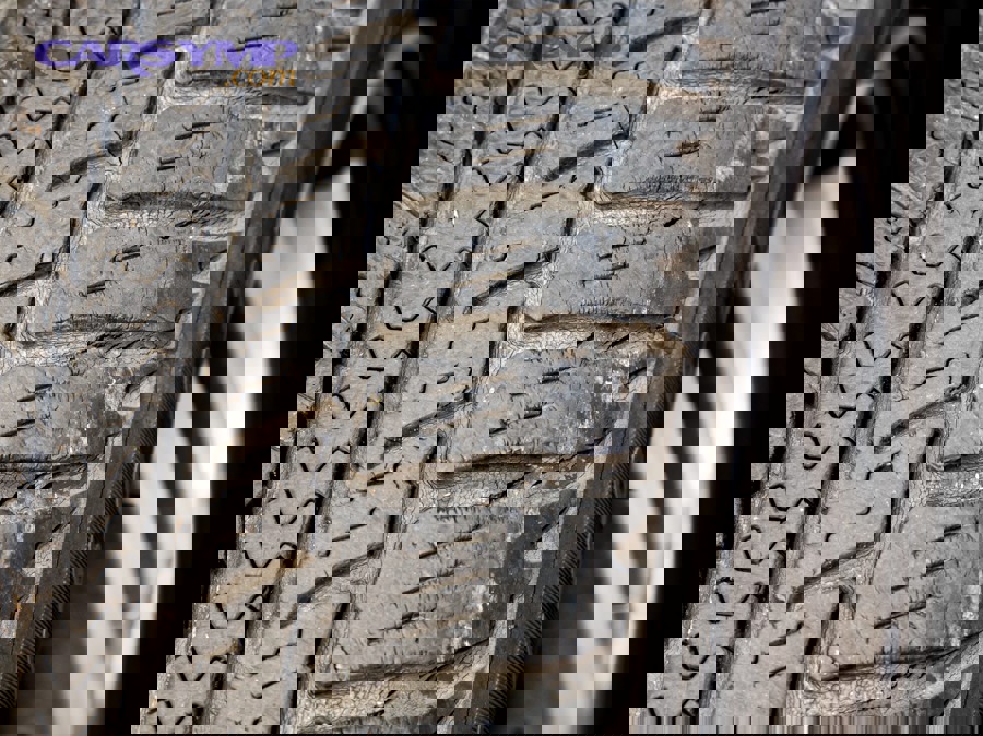 Tire sidewall cracking showing early signs of dry rot on an aged tire