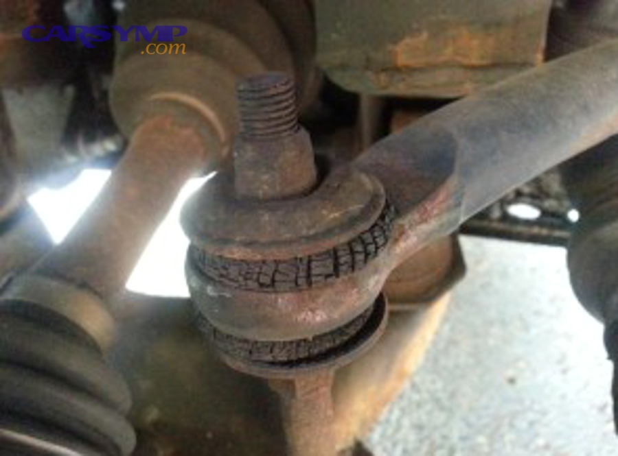 Comparison of new and worn sway bar links showing visual differences in bushing condition
