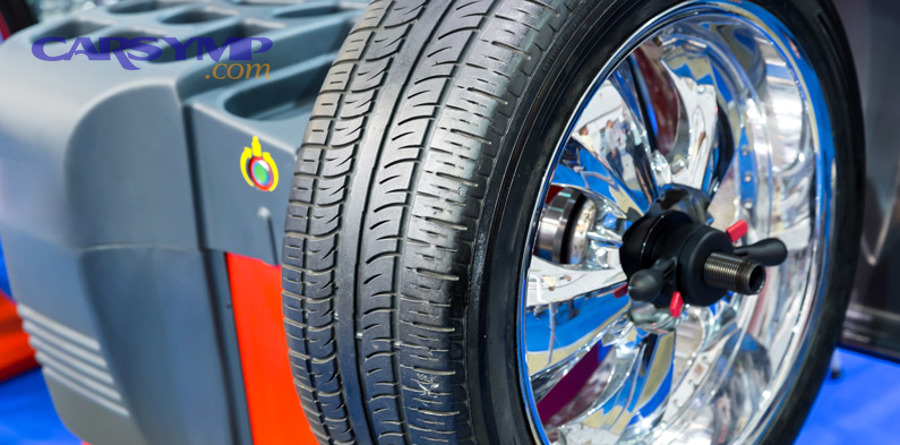 Auto shop comparing wheel balancing and wheel alignment services