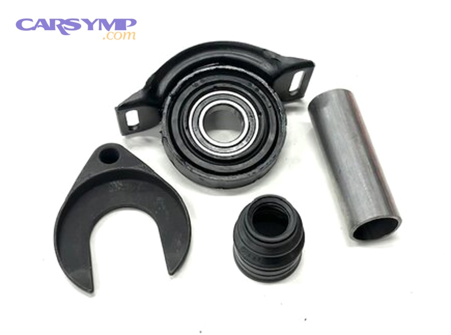 Mechanic examining a damaged wheel assembly related to wheel bearing failure