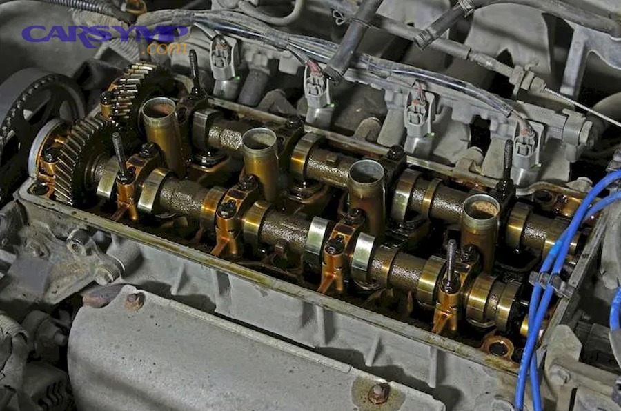 Open engine bay showing components that affect valve cover gasket labor time