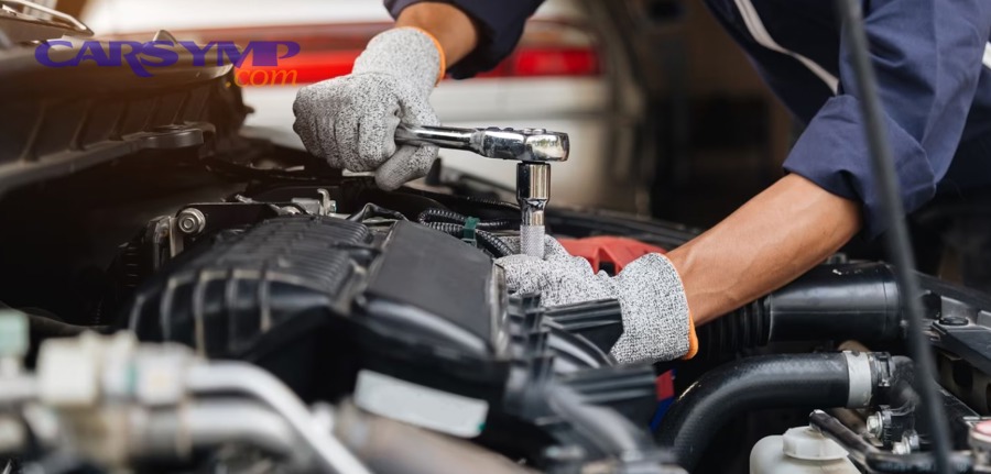 Mechanic performing a modern car tune-up under the hood