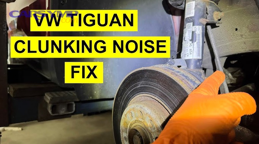 mechanic using pry bar to test suspension component for excessive play