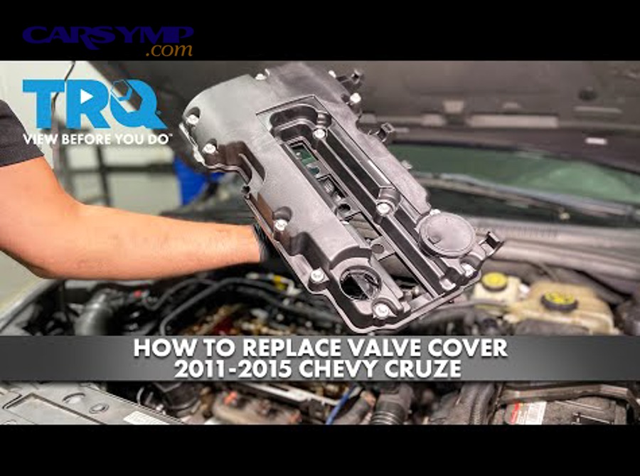 Mechanic cleaning engine oil residue after valve cover gasket leak