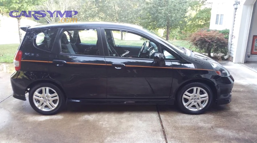 DIY mechanic using jack stands and hand tools for home garage shock absorber replacement