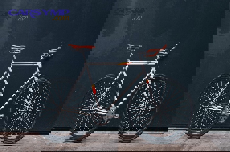 bicycle chain being cleaned with spray lubricant