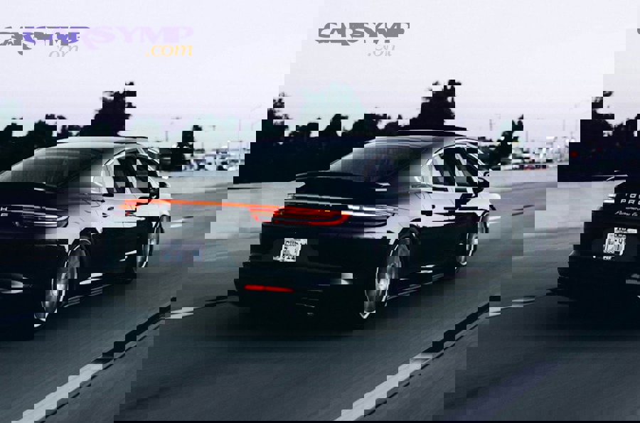 Modern sports car on winding road demonstrating steering precision and handling