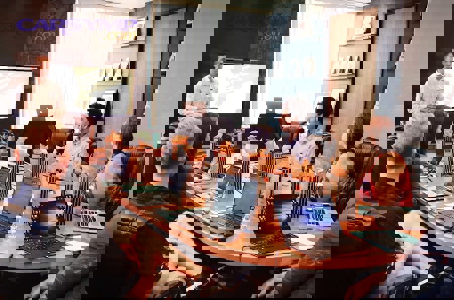 construction project meeting with contractor and client reviewing budget contingency planning documents