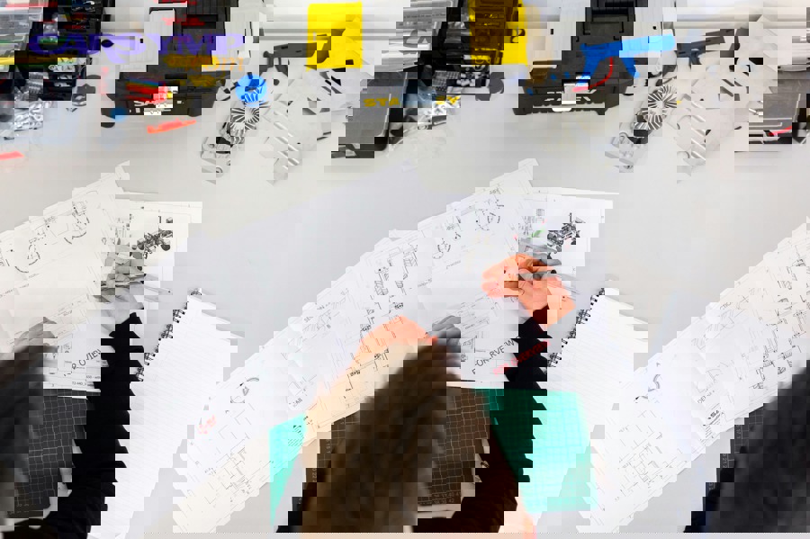 Automotive diagnostic scanner showing live data readings for troubleshooting black smoke