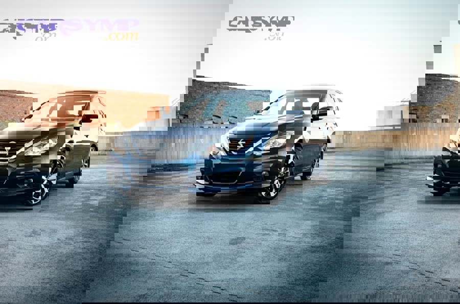 mechanic working underneath truck removing starter motor