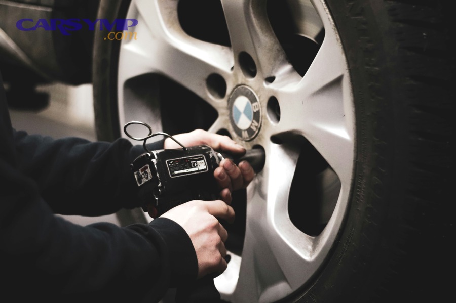 mechanic working on vehicle transmission service