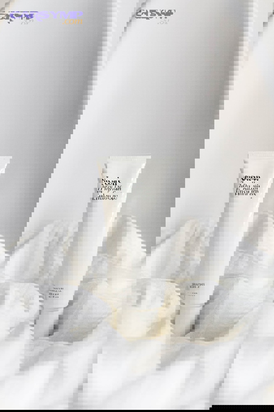 hand adjusting home thermostat temperature setting on wall