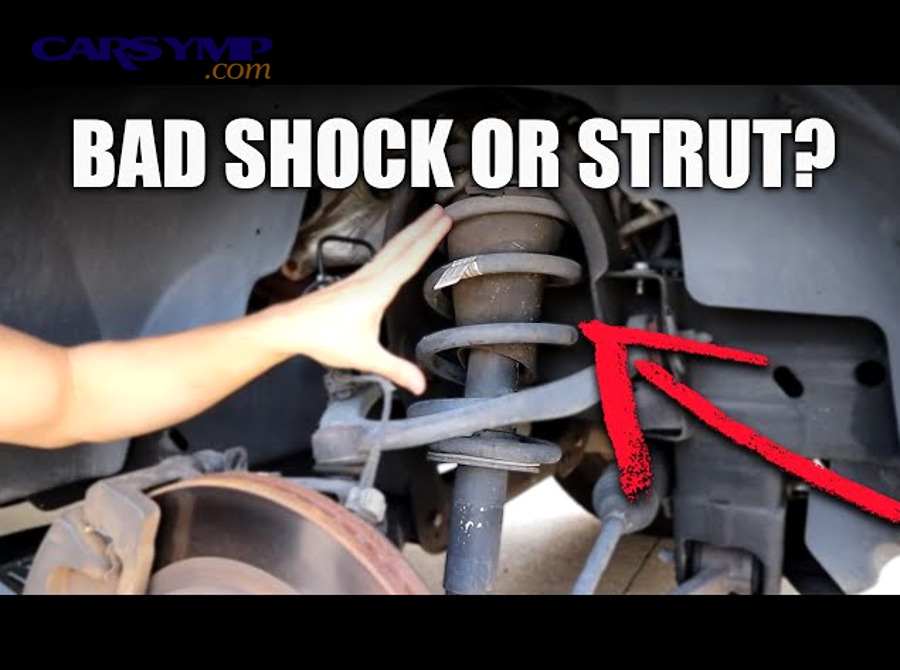 Automotive suspension system showing shock absorber mounting points and surrounding components