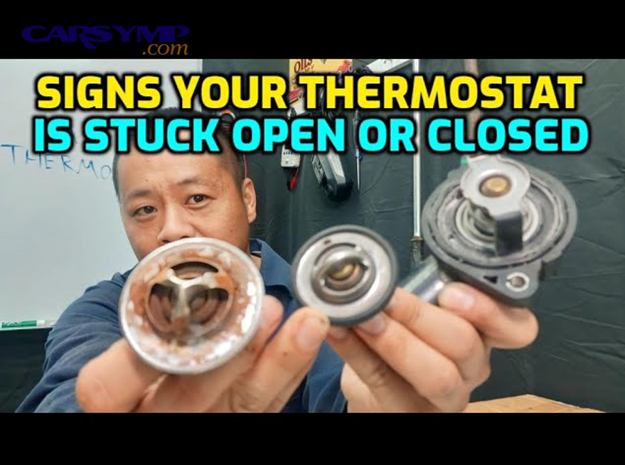mechanic replacing car thermostat