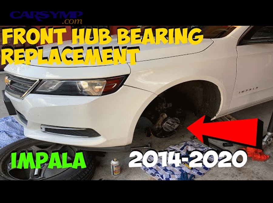 Mechanic inspecting front wheel hub and bearing area