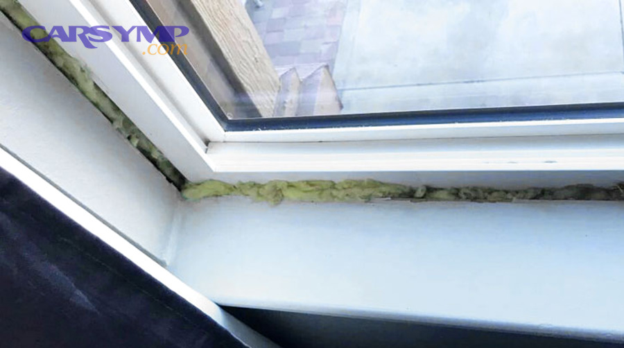 Mechanic installing components on the front of an engine