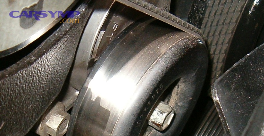 Engine accessory belt and pulleys close-up