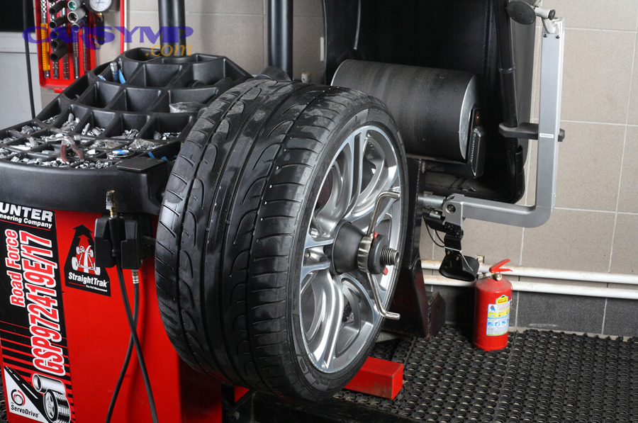 Car on the road after new tires and balancing service