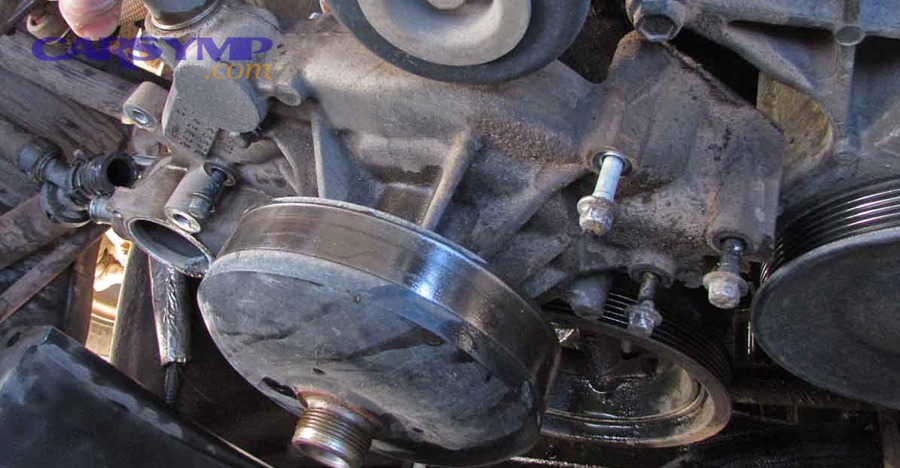 mechanic diagnosing cooling system components