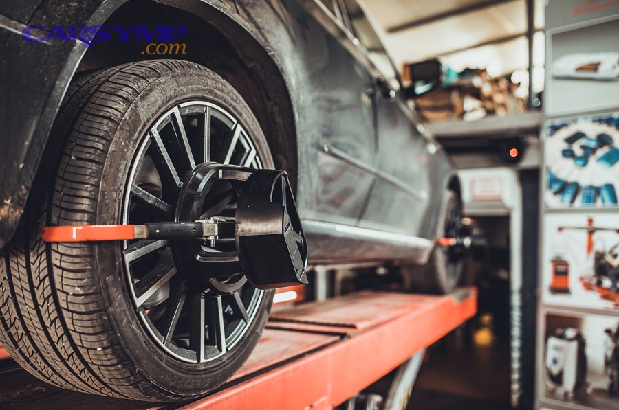 car on service lift for wheel alignment